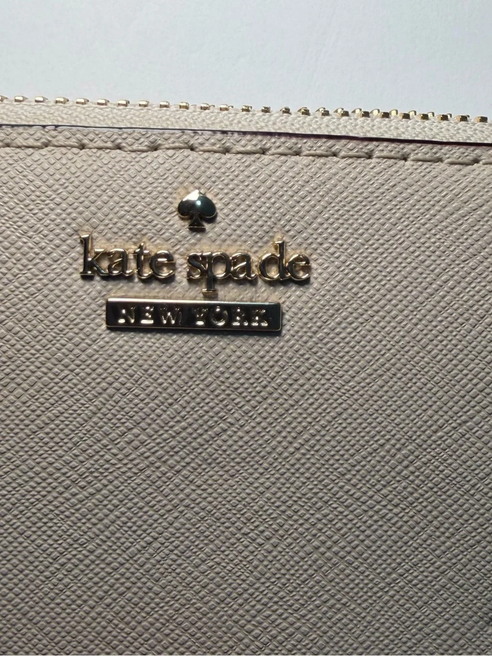 kate spade beige Minnie Mouse zip-around wallet